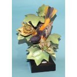 A Royal Worcester porcelain figure "Baltimore Oriole", with printed and impressed marks, 25cm