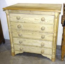 A pine chest of five long drawers, 86cm wide, 90cm high.