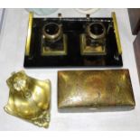 An Art Deco-style double-inkstand on rectangular black glass base, with brass handles and mounts and