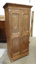 A hardwood two-door cigar storage cupboard grooved for ten shelves, the doors stencilled "Flor de