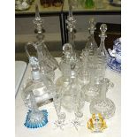 A collection of 19th century and later glass decanters, a pair of small vases with starfish bases,