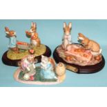 A collection of eleven John Beswick Beatrix Potter figures, including 'Peter and Benjamin Picking