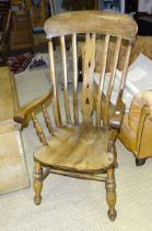 An elm and beech lathe-back kitchen chair on turned legs and a spindle-back farmhouse chair, (cut