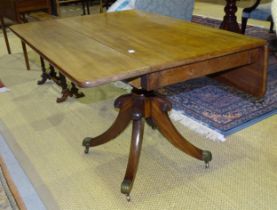 A 19th century mahogany drop leaf rectangular top breakfast table on turned column and four