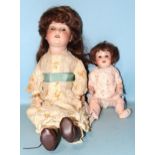 A Porzellanfabrik Mengersgereuth bisque head doll, marked PM 914 Germany 1, with sleeping brown