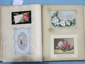 A Victorian album, the first 40 pages with an assortment of Victorian greetings cards and scraps,