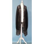 A 1920's black and silver-beaded three-quarter-length evening jacket of black net lined with cream