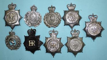 A collection of nine police force helmet badges: Clitheroe Borough, St Helens, Lancashire