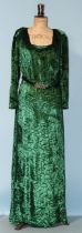 A 1930's emerald green devoré velvet evening dress with long sleeves, the fitted bodice fastened