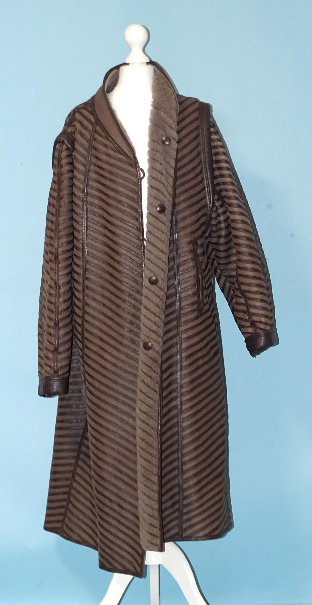 A faux Astrakhan coat, an early-20th century black crepe coat, a later leather/sheepskin - Image 3 of 4