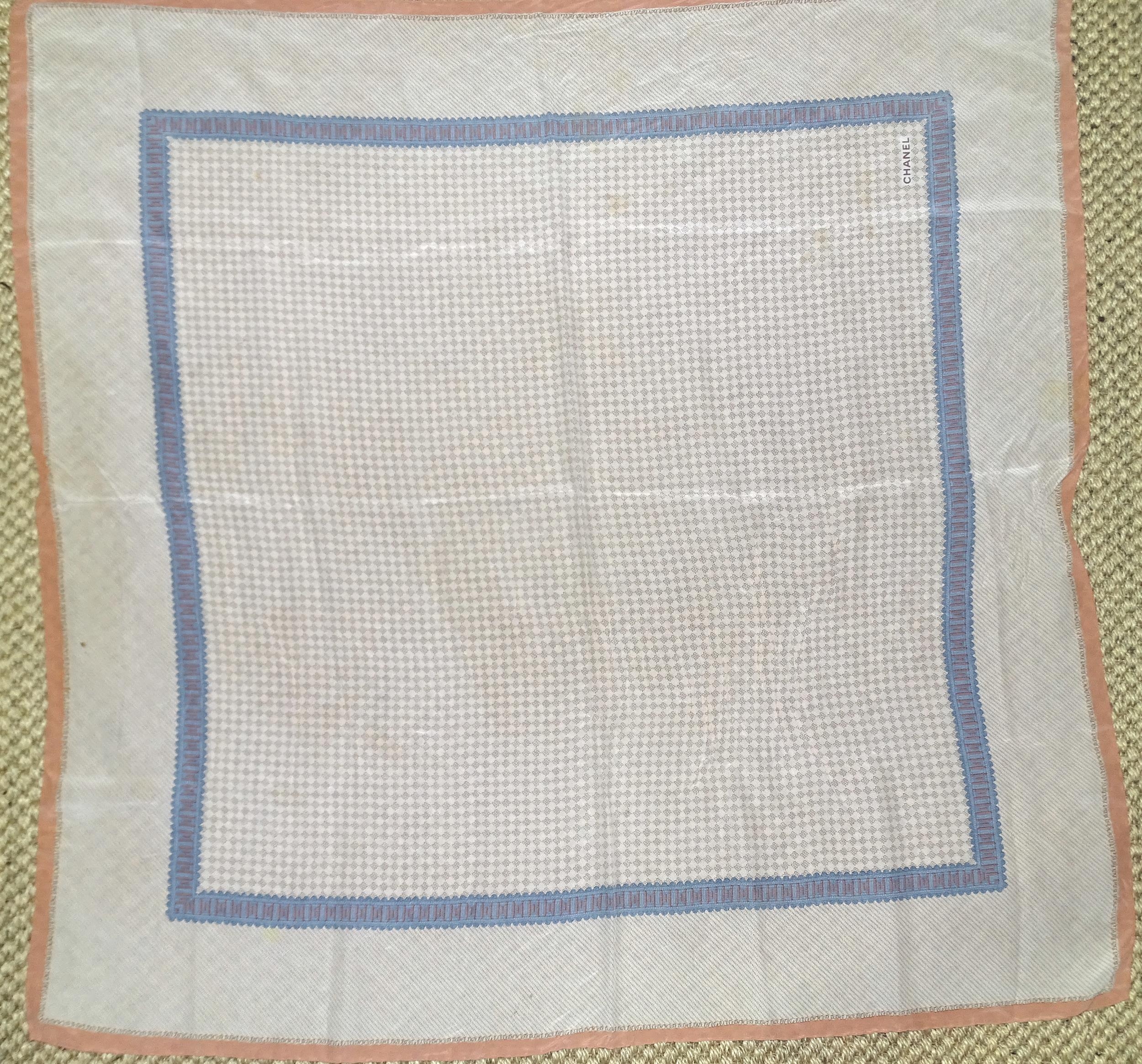 Chanel, a silk scarf in muted apricot and blue on a light background, 86cm square.