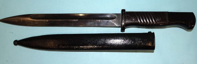 A WWII German K98 combat bayonet with two-piece Bakelite grips, the blade stamped 1559, reverse side