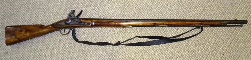 A 19th century Gurkha flintlock musket, with 99cm barrel, steel rammer, mahogany full-length stock