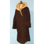 A 1950's brown Persian lamb coat with fur collar.