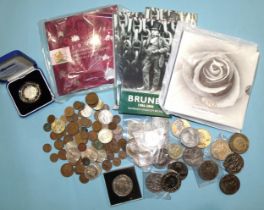 A Royal Mint 2000 Millennium silver £5 coin in case, a 1993 BU coin collection, twenty commemorative