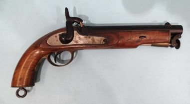 A replica percussion cap pistol, with walnut stock and retained steel rammer, 19cm barrel, 34cm