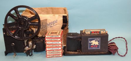 An NIC projector c1940's, of tinplate and card construction, with one paper roll-film, "La Vengeance