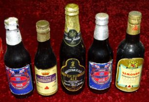 A collection of sixteen various commemorative unopened bottled ales: Simonds 1947 Royal Wedding,