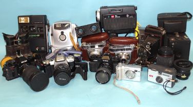 A quantity of cameras: Pentax MZ-50, Ricoh KR-10 and others by Kodak, Vivitar, etc.