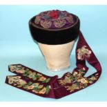 A rare 19th century embroidered silk Chinese hat, the padded purple silk crown overlaid with a