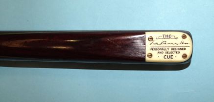 A collection of three snooker cues: 'The Camkin Cue', 58'' 17oz, 'The Joe Davis 146', (red and white