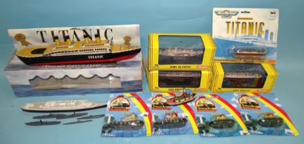 Three boxed Gilbow ships: RMS Titanic, Britannic and Olympic, six diecast waterline ships, a