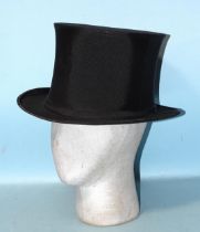 A vintage collapsible silk opera hat.