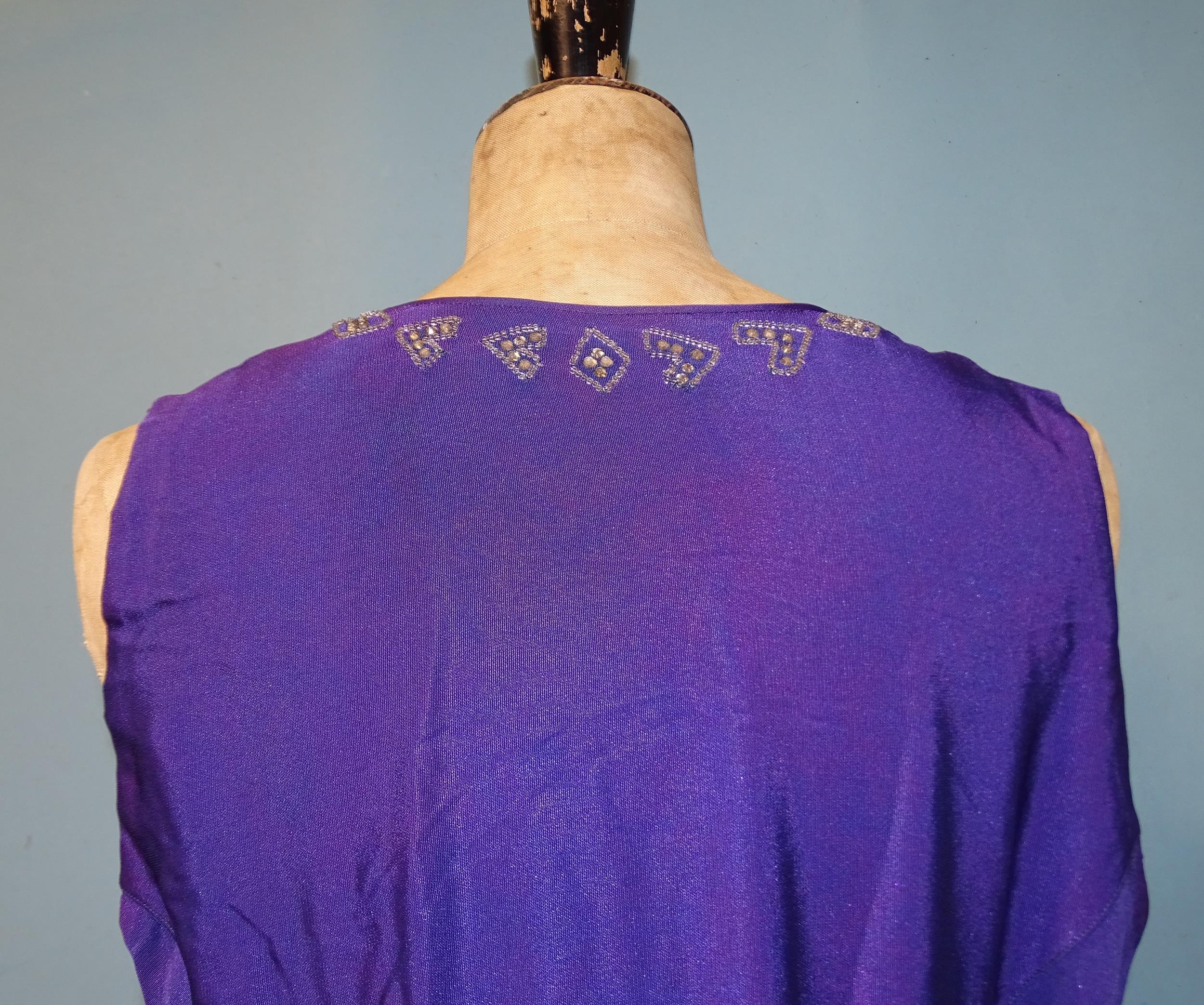 A 1930's evening dress of purple satin-like material, sleeveless, with hand-beading to neckline, the - Image 5 of 5