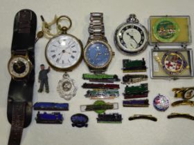 An Ingersoll Triumph wrist watch, a Tevise wrist watch, two pocket watches, various railway engine
