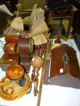 A wooden model of a junk, a pair of wooden bookends, a striking mantel clock and other wooden items.