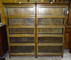 A pair of oak bookcases in the Globe Wernicke style, each with five glazed compartments, 171cm high,