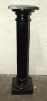 An ebonised wood fluted architectural column, 107cm high.