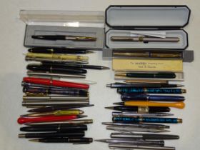 A Conway Stewart '15' fountain pen, Easterbrook and Osmiroid fountain pens, a silver propelling