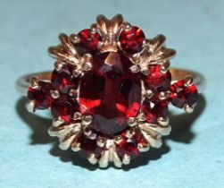 A 9ct gold ring set garnet cluster, size R, 4.3g.