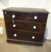 A stained pine chest of two short and two long drawers, 91cm wide, 87cm high, a wash stand and an