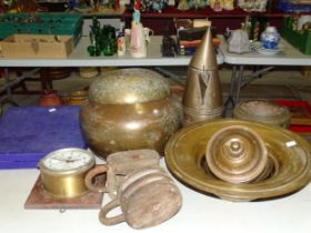 An Eastern brass wide-rimmed dish, a conical metal coffee pot, a pair of wood and iron blocks and