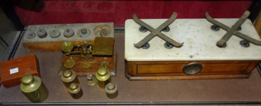 A collection of various apothecary weights, postal scales and kitchen weighing scales, (dishes