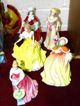 A collection of five Royal Doulton figurines from the 'Pretty Ladies' series: 'Autumn' HN5323, '