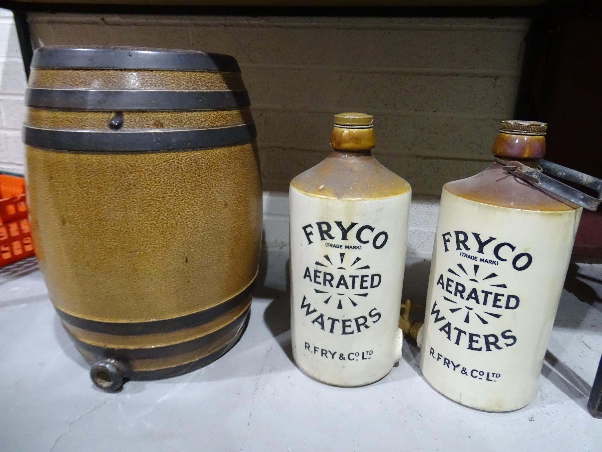 A large Doulton and Lambert stoneware barrel, 58cm high, top 33cm diameter and two 2-gallon 'Fryco