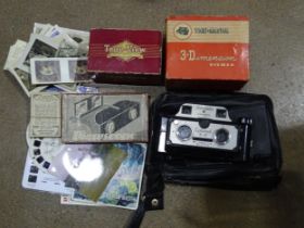 A Coronet 3-D camera in case, a True-View stereoscope, (boxed), with four reels of film, a View-