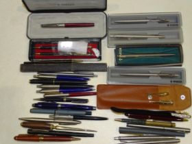 A collection of various ballpoint pens, etc, including Parker and others.