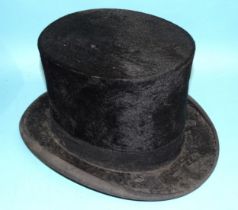 A silk top hat by Tress & Co, London, in leather hat box, a barrister's gown, starched wing