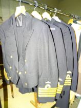 Two Royal Navy uniforms, a dress suit and other items.