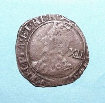 A Charles I (1625-1649) hammered silver shilling, two George III (1760-1820) crowns, 1819 and