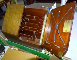 An Edwardian mahogany stationery cabinet with hinged sloping doors, 38cm wide, 32cm high,