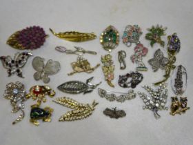 Twenty-five costume brooches.