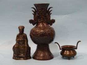 A bronze model of a Chinese seated figure, 15cm high and other items.