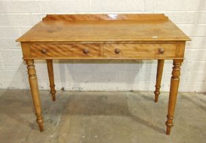 A Victorian satinwood two-drawer side table, the rectangular top above two frieze drawers, on turned