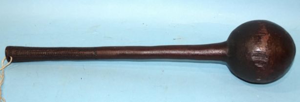 A Fijian ula or throwing club with spherical knob and chip-carved grip, 40cm long.