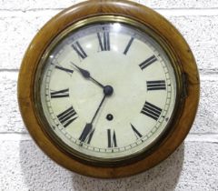 A Victorian oak wall clock with circular white enamel dial and single-train movement, 30cm.